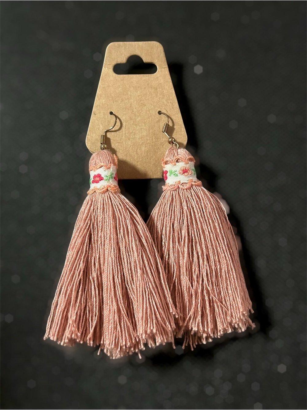 Blush pink shoulder duster tassel earrings with embroidered flower detail